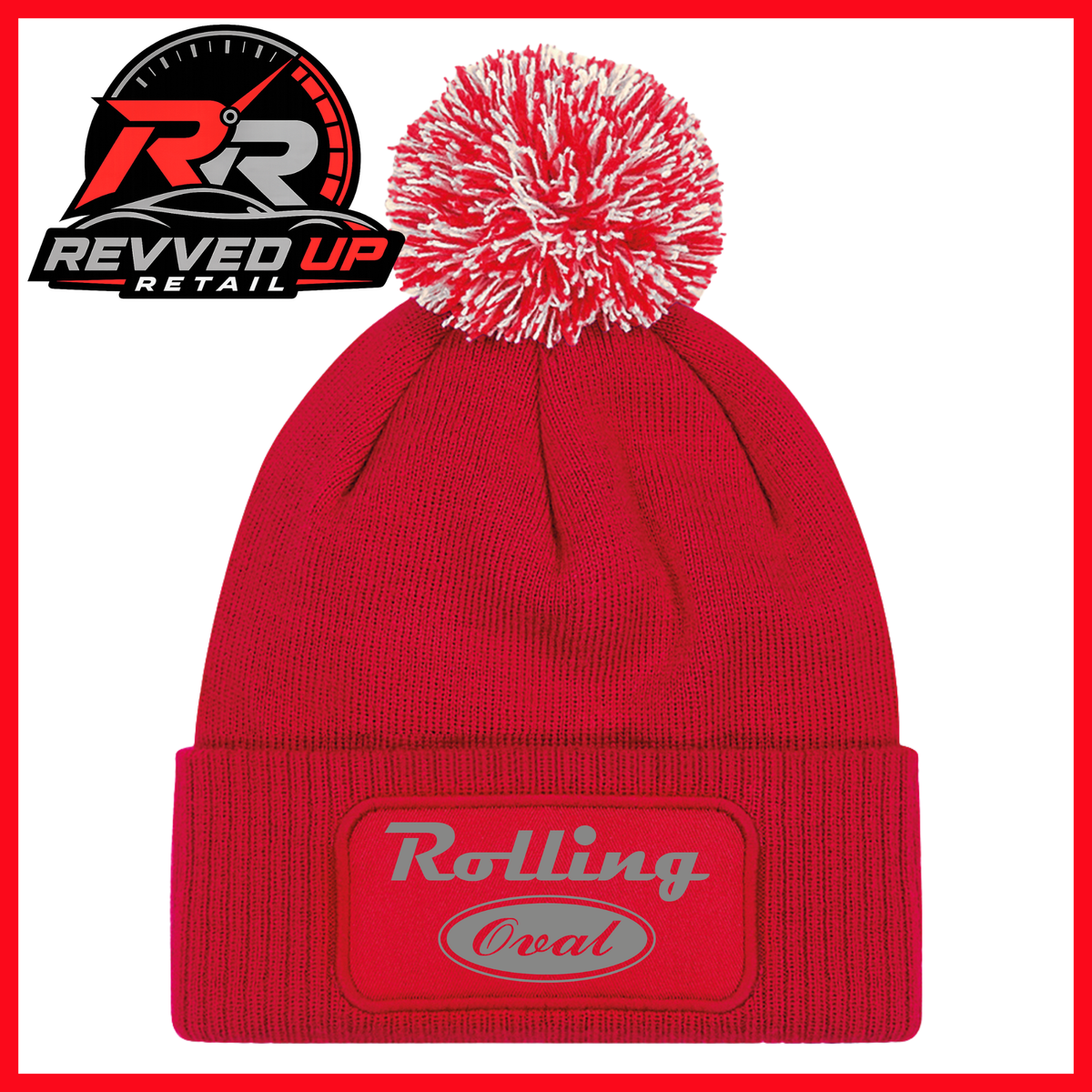 A red knit beanie with a white and red pom-pom on top and a red cuffed front patch reading 'Rolling Oval' in grey. A Revved Up Retail logo appears in the upper left corner.