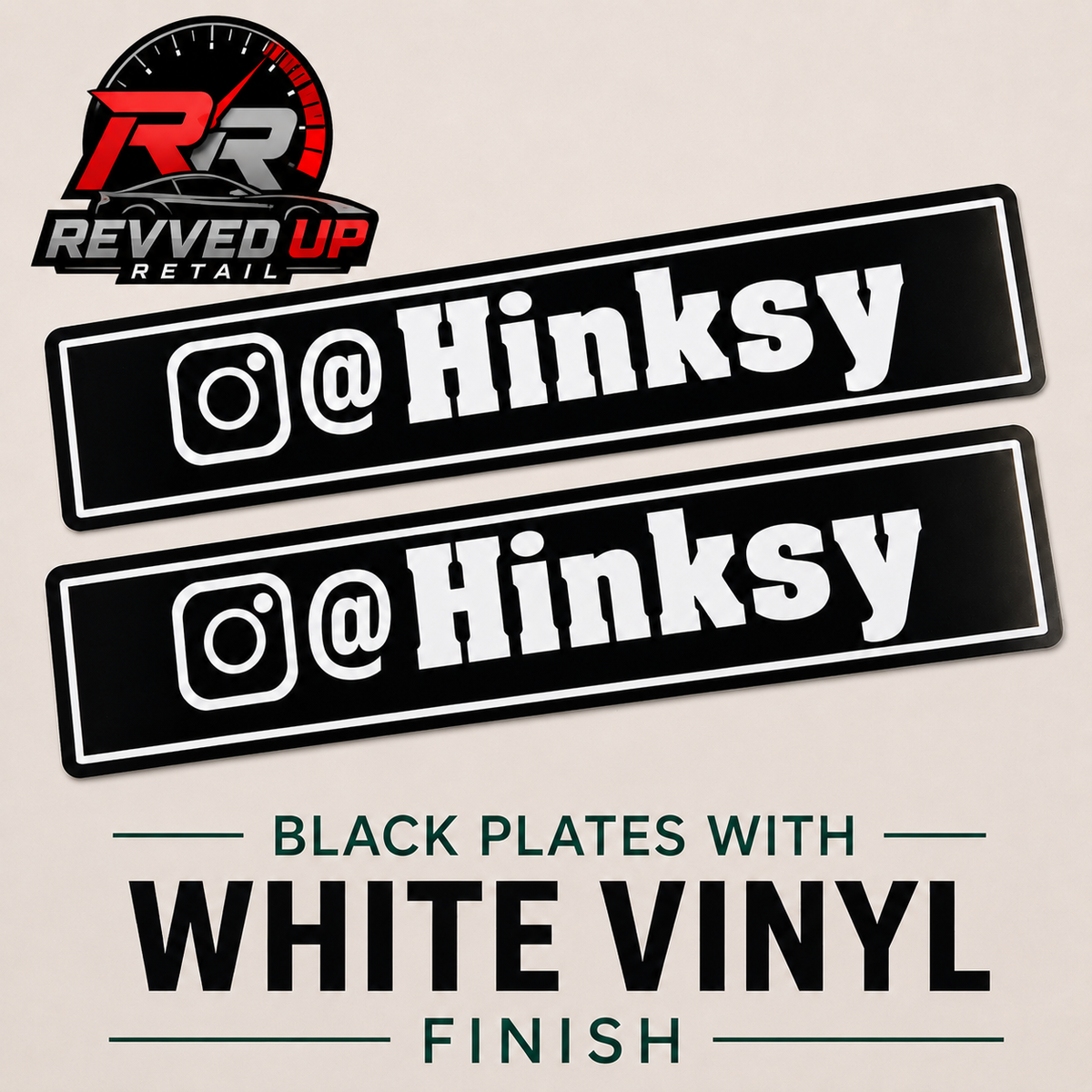Two black rectangular vinyl decals with white Instagram-style icons and the text '@Hinksy' are shown on a light beige background. The Revved Up Retail logo appears in the top left, and text below reads 'BLACK PLATES WITH WHITE VINYL FINISH.