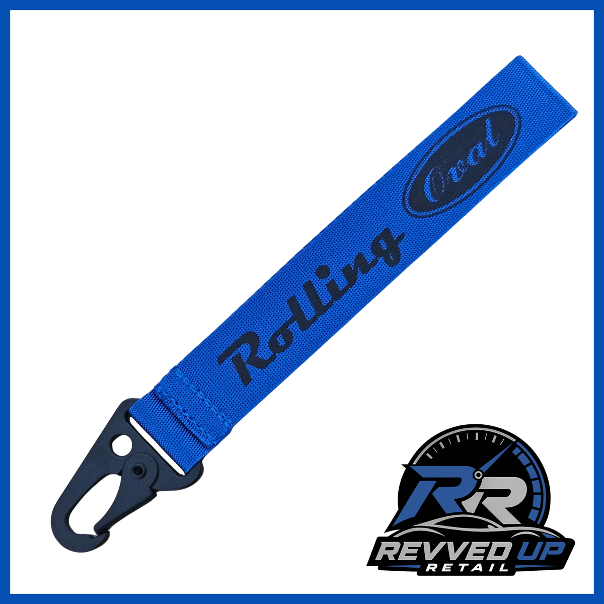A Rolling Oval brand wristlet strap in blue with black printed logos and a black metal carabiner clip, shown on a white background with a Revved Up Retail watermark.