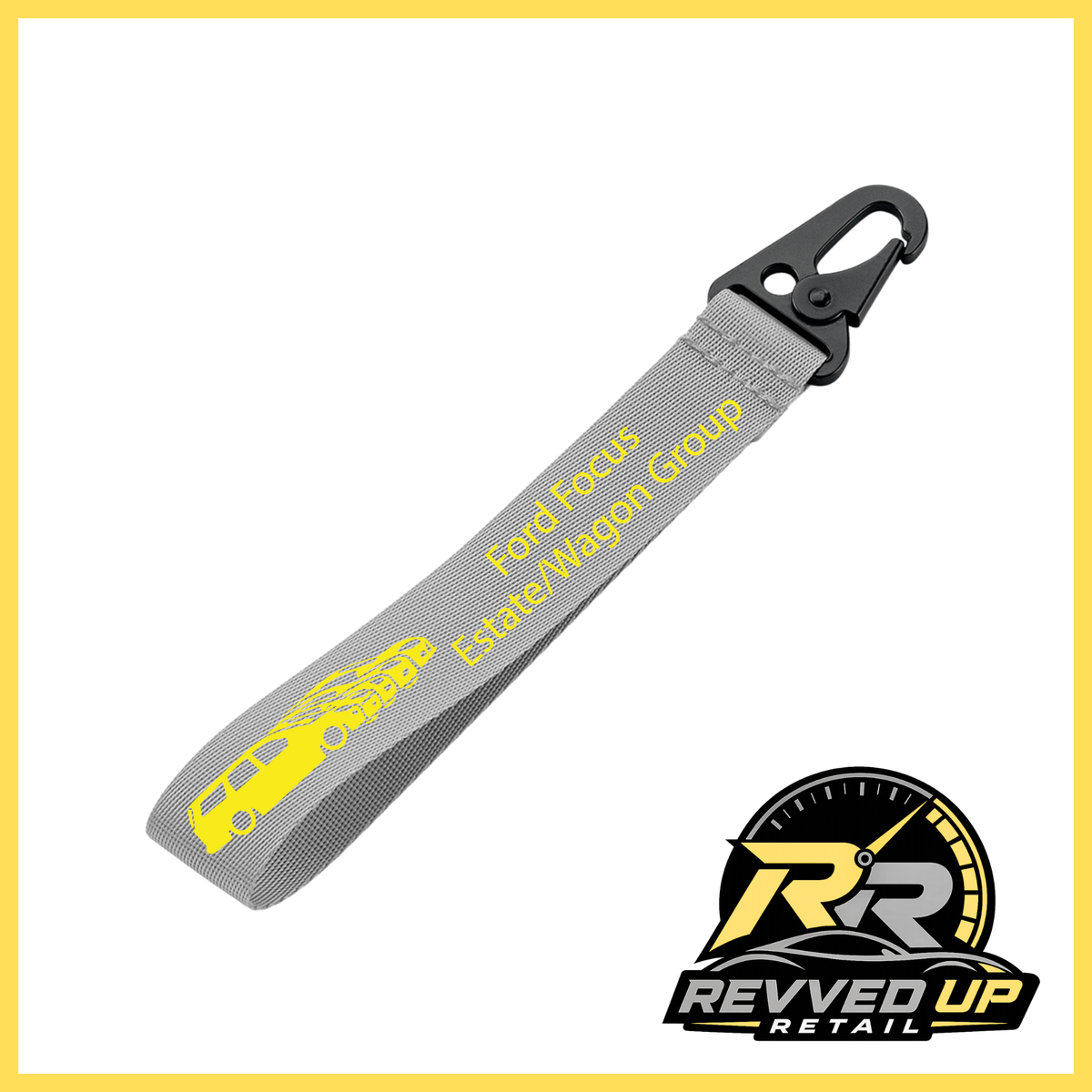 A Ford Focus Estate/Wagon Group brand wristlet strap in grey with yellow printed logos and a black metal carabiner clip, shown on a white background with a Revved Up Retail watermark.