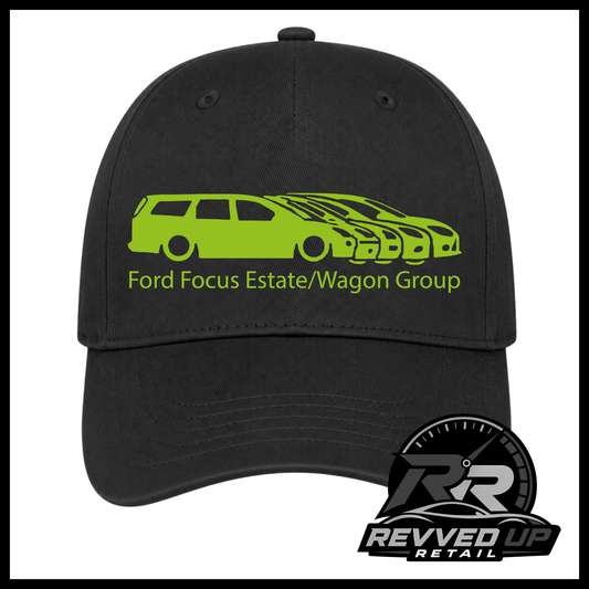 A black baseball cap featuring a green graphic of a Ford Focus estate and wagon group with the text 'Ford Focus Estate/Wagon Group' on the front. A Revved Up Retail logo is visible in the bottom right corner.