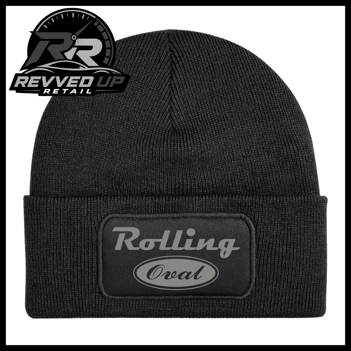 A black ribbed knit beanie hat with a folded cuff, featuring a rectangular patch on the front that reads 'Rolling Oval' in grey. The Revved Up Retail logo is visible in the top-left corner.