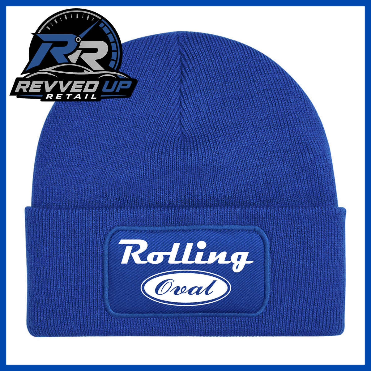 A royal blue ribbed knit beanie with a folded cuff featuring a rectangular patch that reads 'Rolling Oval' in white. A Revved Up Retail logo is visible in the top-left corner.