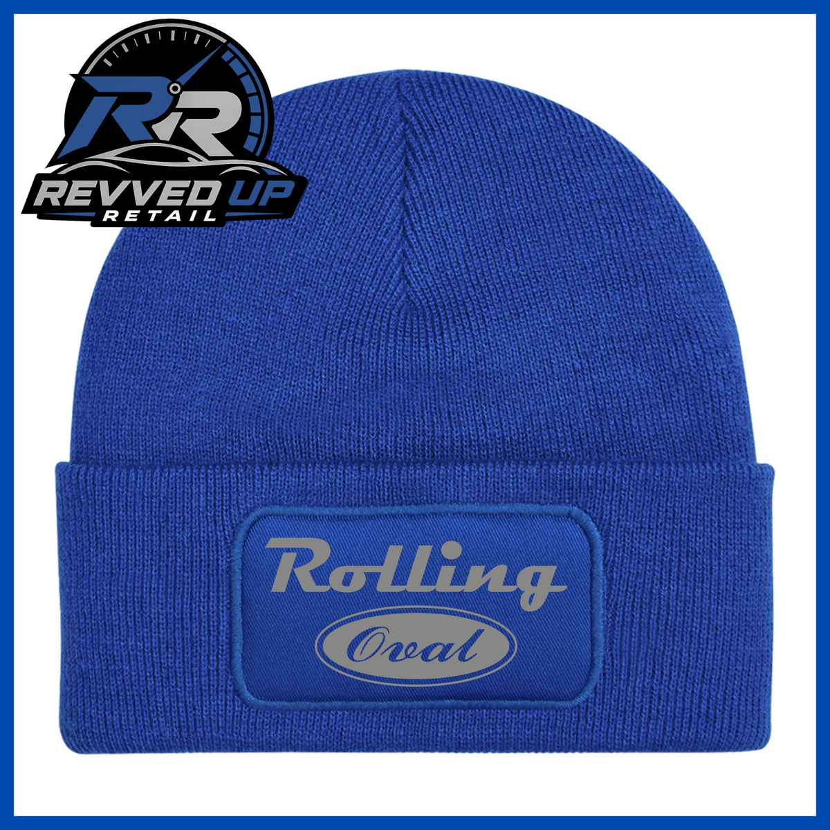 A royal blue ribbed knit beanie with a folded cuff featuring an oval patch that reads 'Rolling Oval' in grey. A Revved Up Retail logo is visible in the top-left corner.
