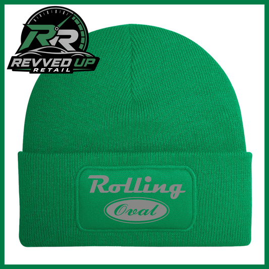 A green ribbed knit beanie with a cuffed brim featuring an oval patch that reads 'Rolling Oval' in grey. A Revved Up Retail logo is visible in the top-left corner.