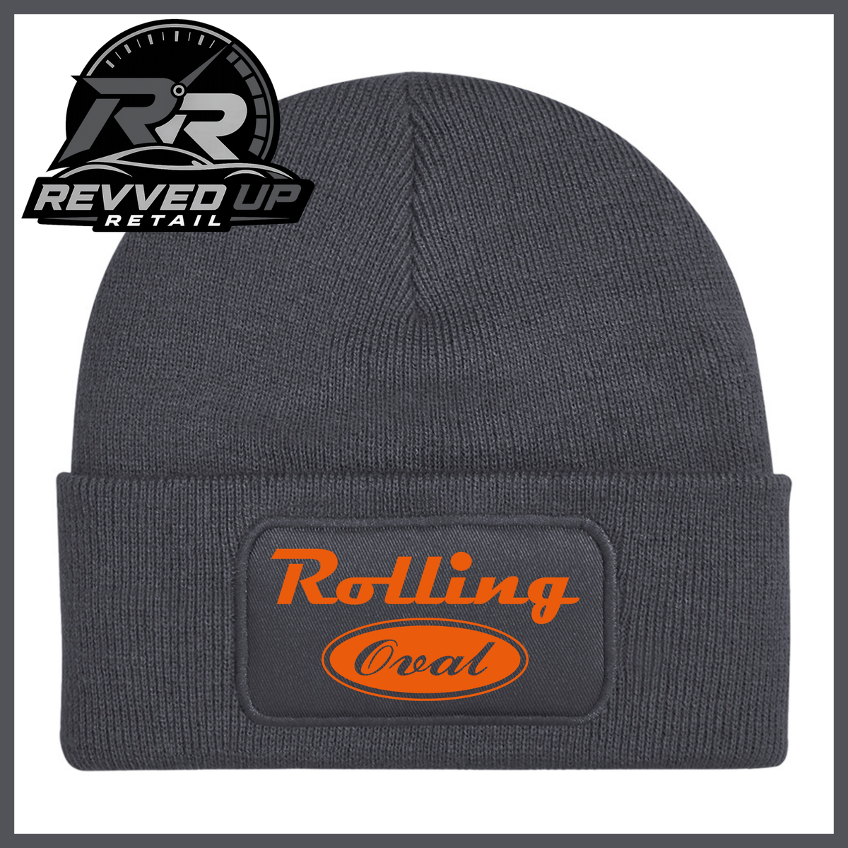 A dark grey ribbed knit beanie with a folded cuff featuring a black patch that reads 'Rolling Oval' in orange. A Revved Up Retail logo is visible in the top-left corner.