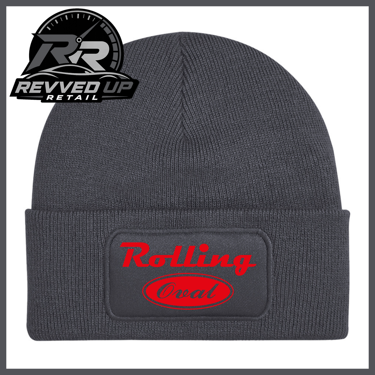 A dark grey ribbed knit beanie with a folded cuff featuring a black patch that reads 'Rolling Oval' in red. A Revved Up Retail logo is visible in the top-left corner.