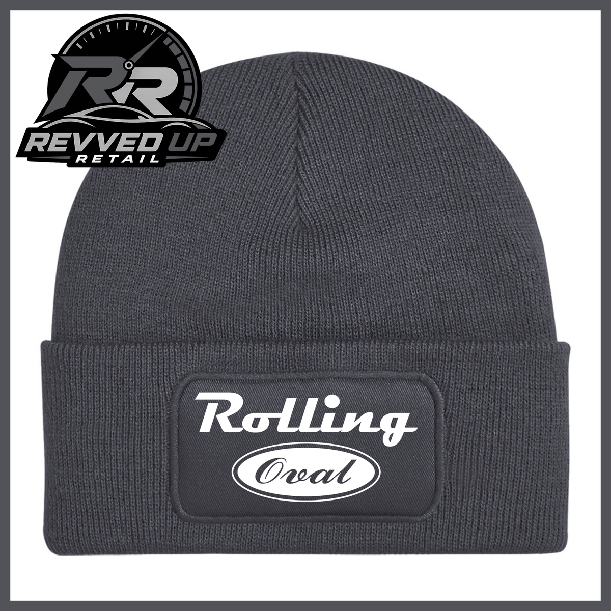 A dark grey ribbed knit beanie with a folded cuff featuring a black patch that reads 'Rolling Oval' in white. A Revved Up Retail logo is visible in the top-left corner.