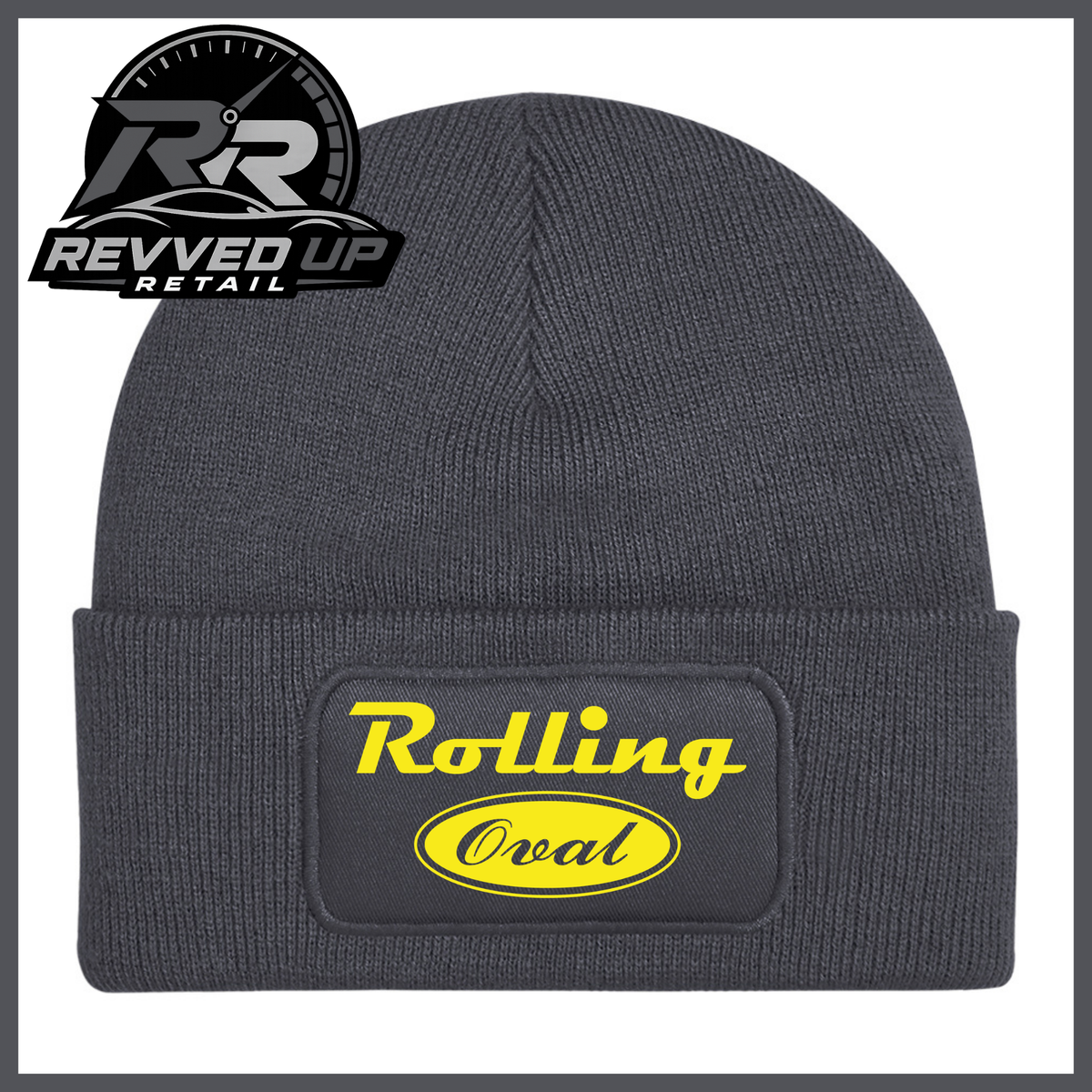 A dark grey ribbed knit beanie with a folded cuff featuring a black patch that reads 'Rolling Oval' in yellow. A Revved Up Retail logo is visible in the top-left corner.