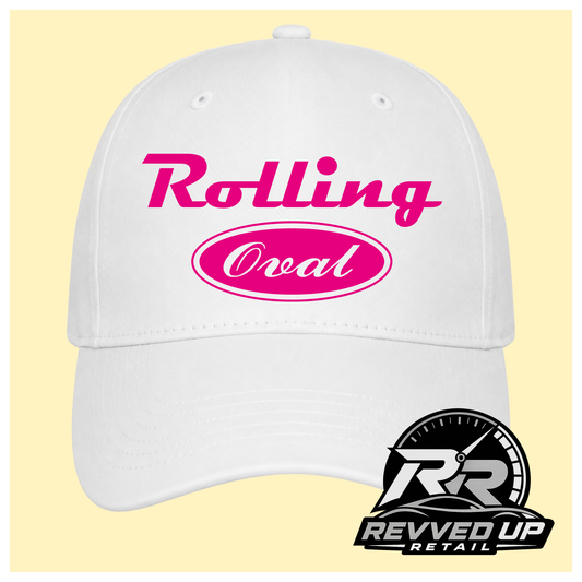 A white baseball cap with hot pink text reading 'Rolling Oval' on the front, shown against a pale yellow background with a Revved Up Retail logo in the bottom right corner.
