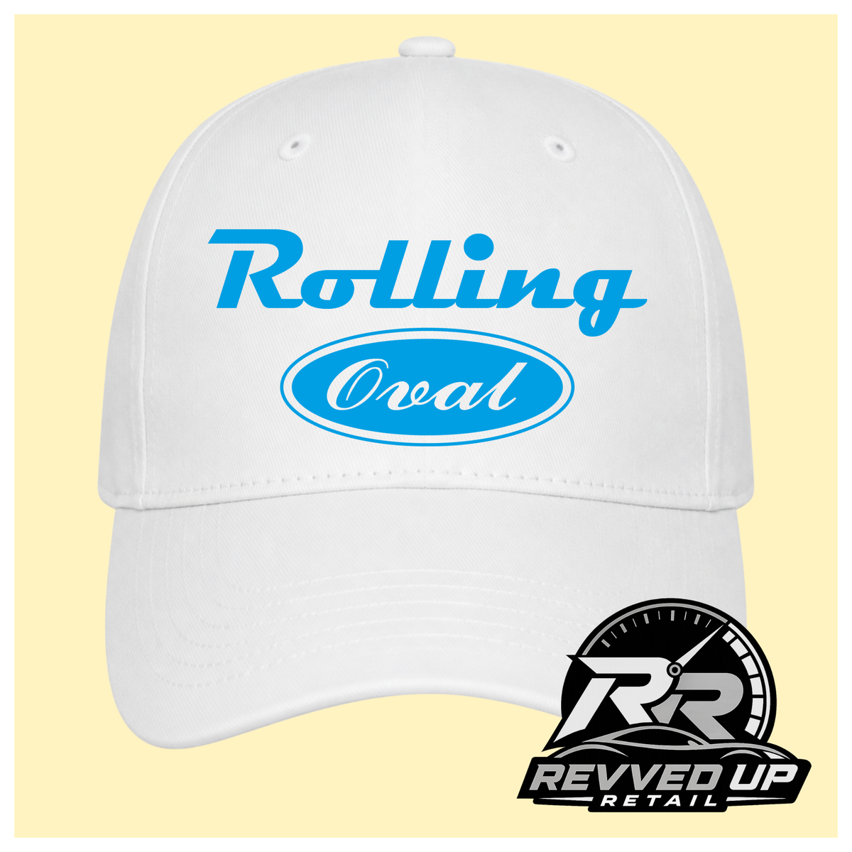 A white baseball cap with light blue text reading 'Rolling Oval' on the front, shown against a pale yellow background with a Revved Up Retail logo in the bottom right corner.
