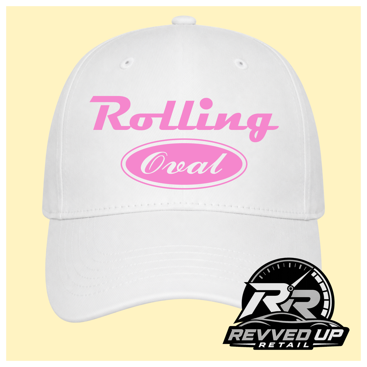 A white baseball cap with pale pink text reading 'Rolling Oval' on the front, shown against a pale yellow background with a Revved Up Retail logo in the bottom right corner.
