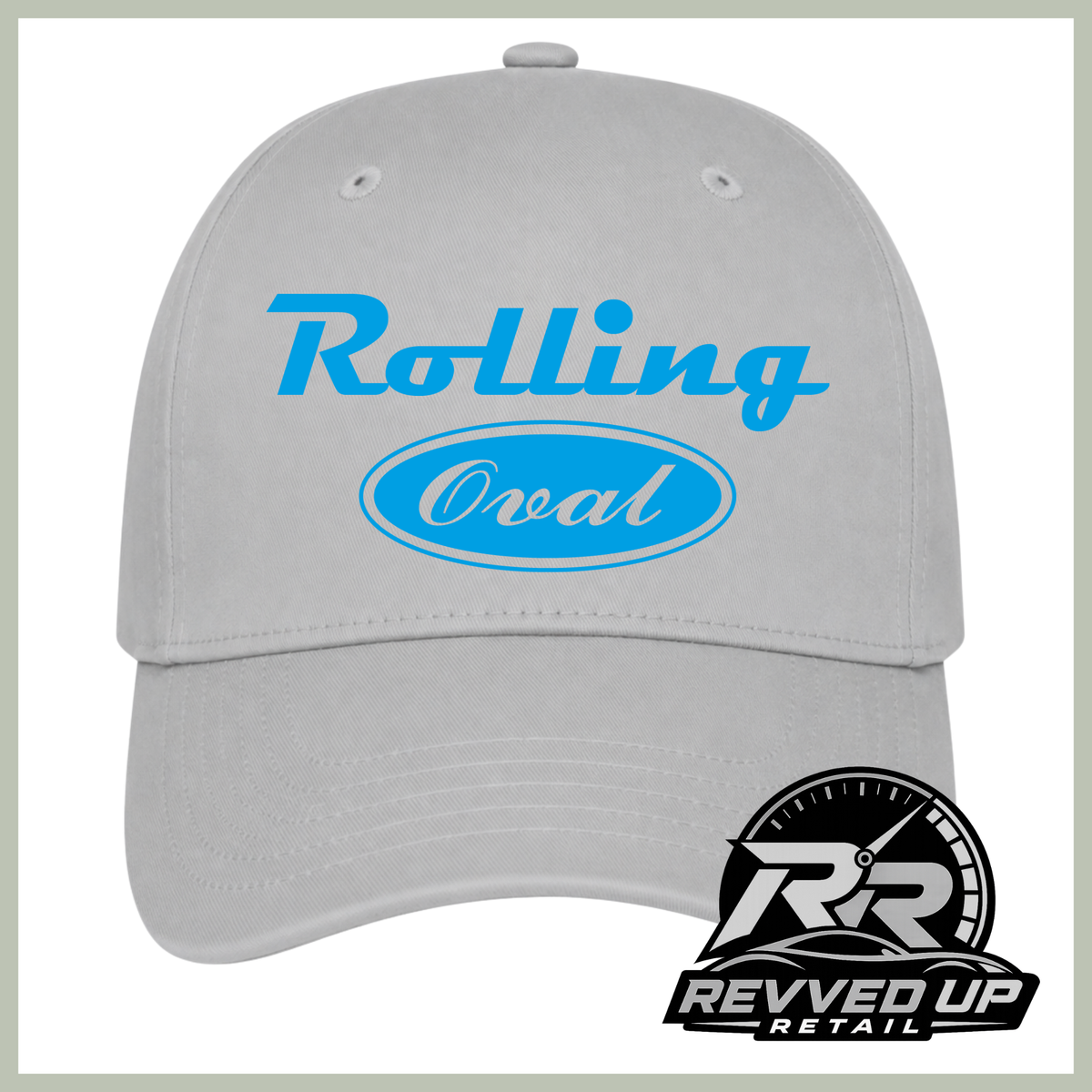 A light gray baseball cap with a blue 'Rolling Oval' logo on the front, shown against a white background with a Revved Up Retail logo in the bottom right corner.