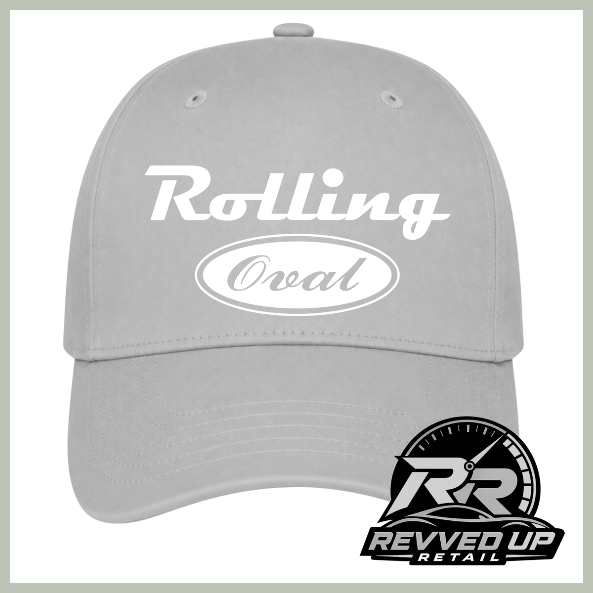 A light gray baseball cap with white text reading 'Rolling Oval' on the front, shown against a white background with a Revved Up Retail logo in the bottom right corner.
