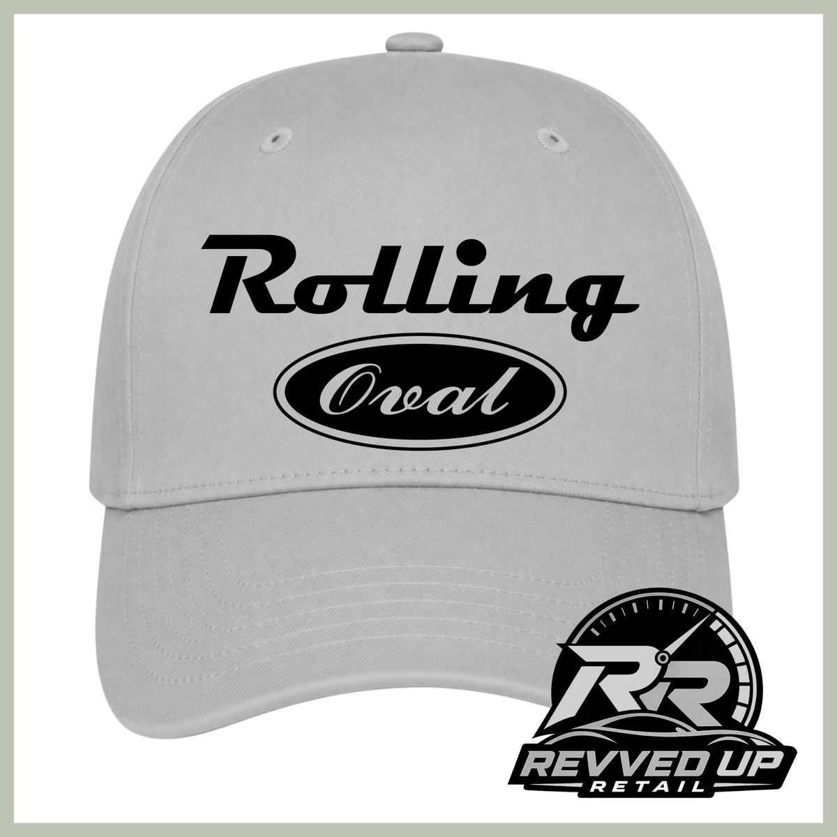 A light gray baseball cap with black text reading 'Rolling Oval' on the front, shown against a white background with a Revved Up Retail logo in the bottom right corner.