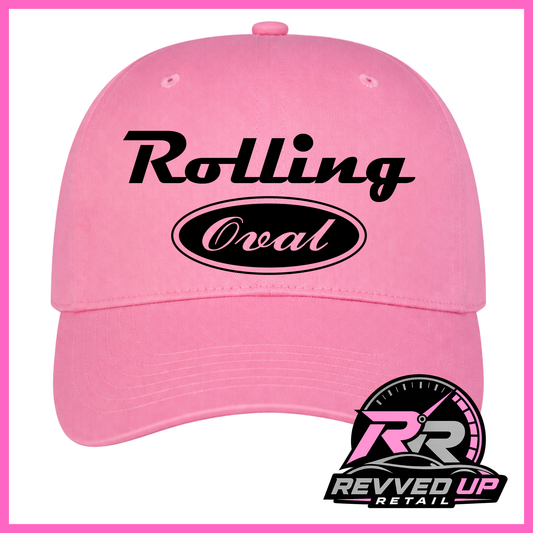 A pink baseball cap with 'Rolling Oval' printed in black on the front, featuring a pink and black Revved Up Retail logo overlay in the bottom right corner.