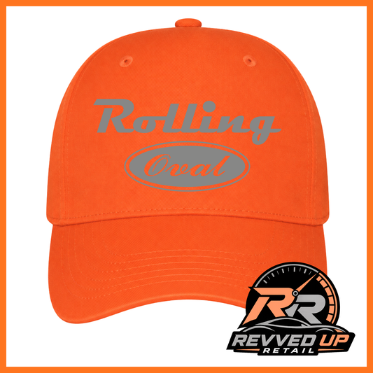 Bright orange baseball cap with a grey 'Rolling Oval' logo on the front, shown on a white background with an orange border. A Revved Up Retail logo is visible in the bottom right corner.
