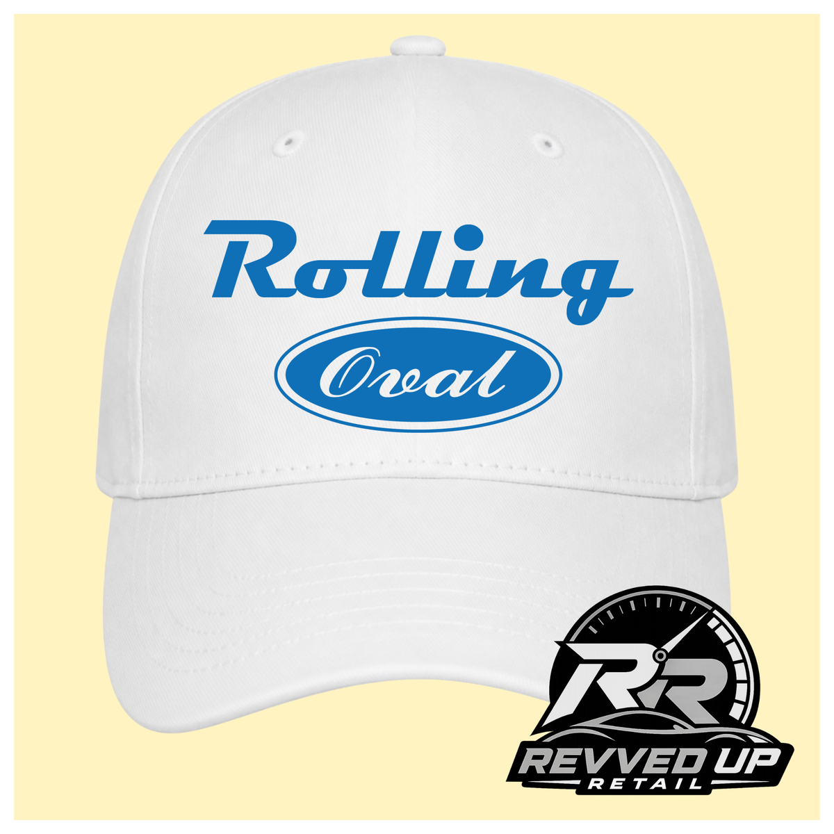 A white baseball cap with blue text reading 'Rolling Oval' on the front, shown against a pale yellow background. A Revved Up Retail logo watermark is visible in the bottom right corner.