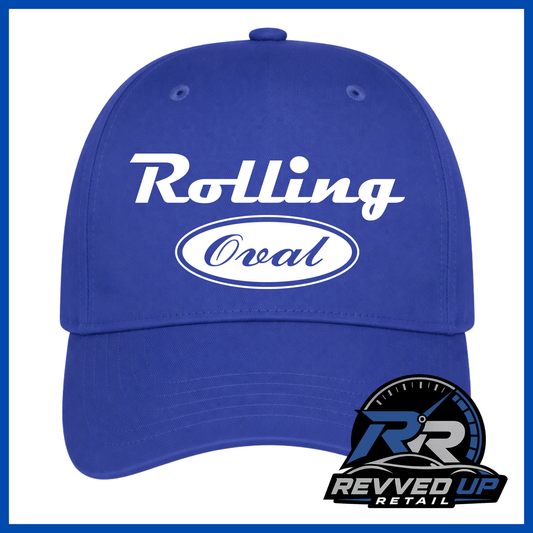 A royal blue baseball cap with 'Rolling Oval' printed in white on the front, shown against a white background with a blue border. A Revved Up Retail logo is visible in the bottom right corner.