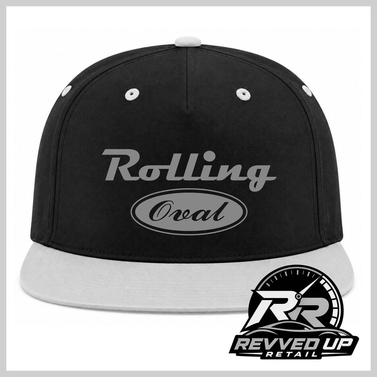 A black flat-brim baseball cap with a grey visor, featuring a grey 'Rolling Oval' graphic on the front. A 'Revved Up Retail' logo is overlaid in the bottom right corner.