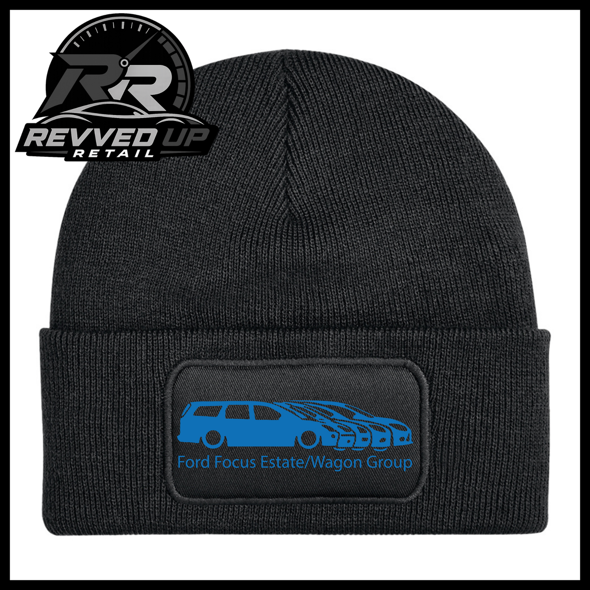 A black ribbed knit beanie with a folded cuff, featuring a black rectangular patch with a blue car graphic and the text 'Ford Focus Estate/Wagon Group.' A Revved Up Retail logo appears in the top-left corner.