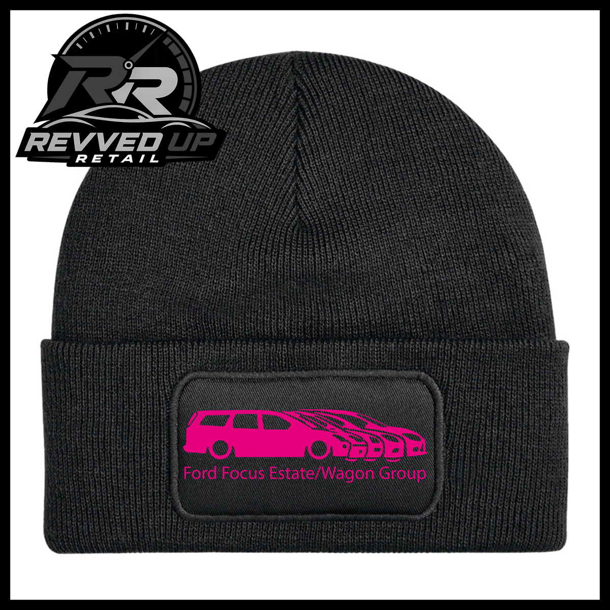 A black ribbed knit beanie with a folded cuff, featuring a black rectangular patch with a hot pink car graphic and the text 'Ford Focus Estate/Wagon Group.' A Revved Up Retail logo appears in the top-left corner. 