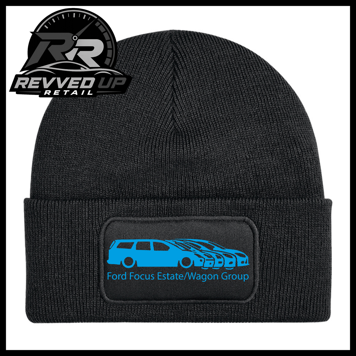 A black ribbed knit beanie with a folded cuff, featuring a black rectangular patch with a light blue car graphic and the text 'Ford Focus Estate/Wagon Group.' A Revved Up Retail logo appears in the top-left corner.