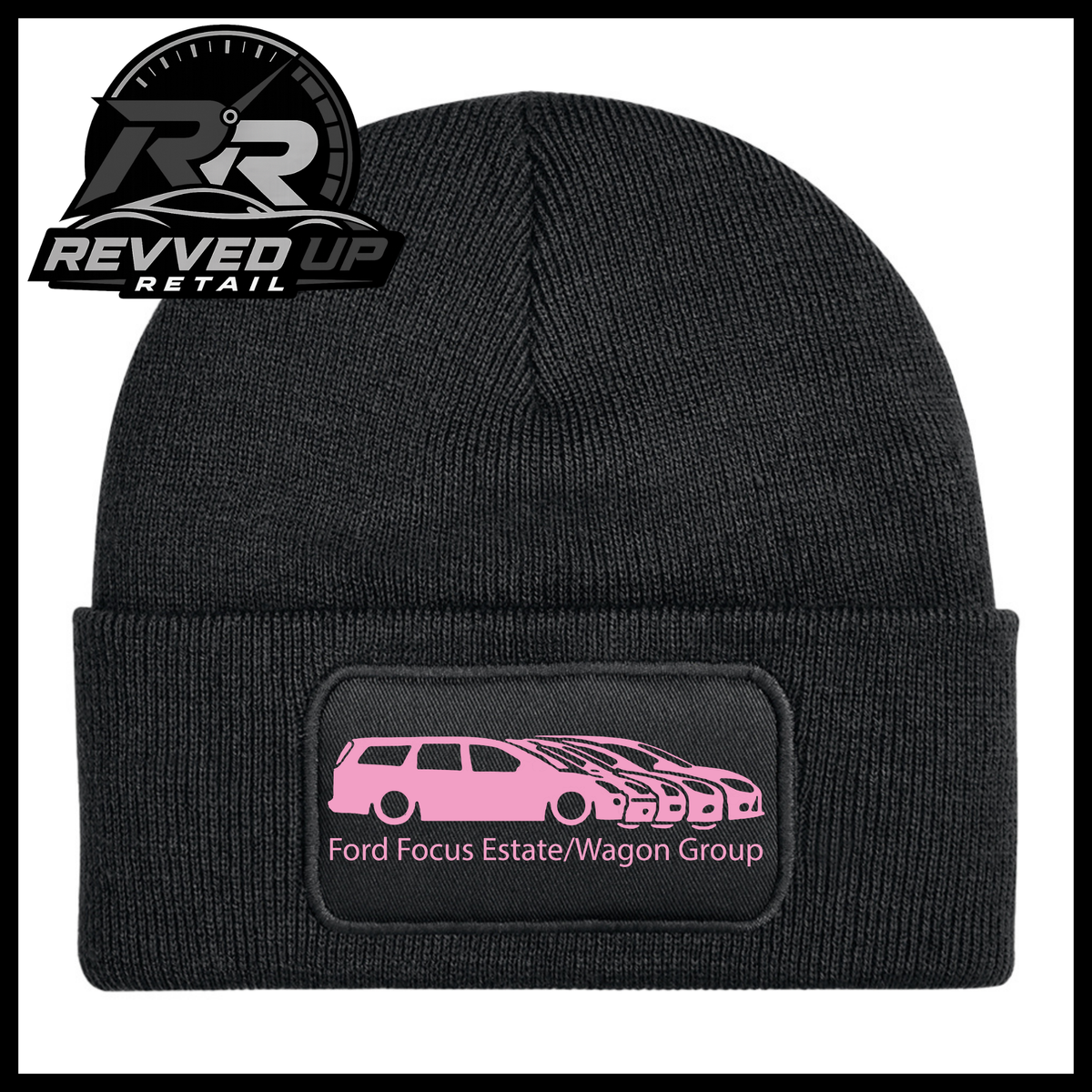 A black ribbed knit beanie with a folded cuff, featuring a black rectangular patch with a pale pink car graphic and the text 'Ford Focus Estate/Wagon Group.' A Revved Up Retail logo appears in the top-left corner.