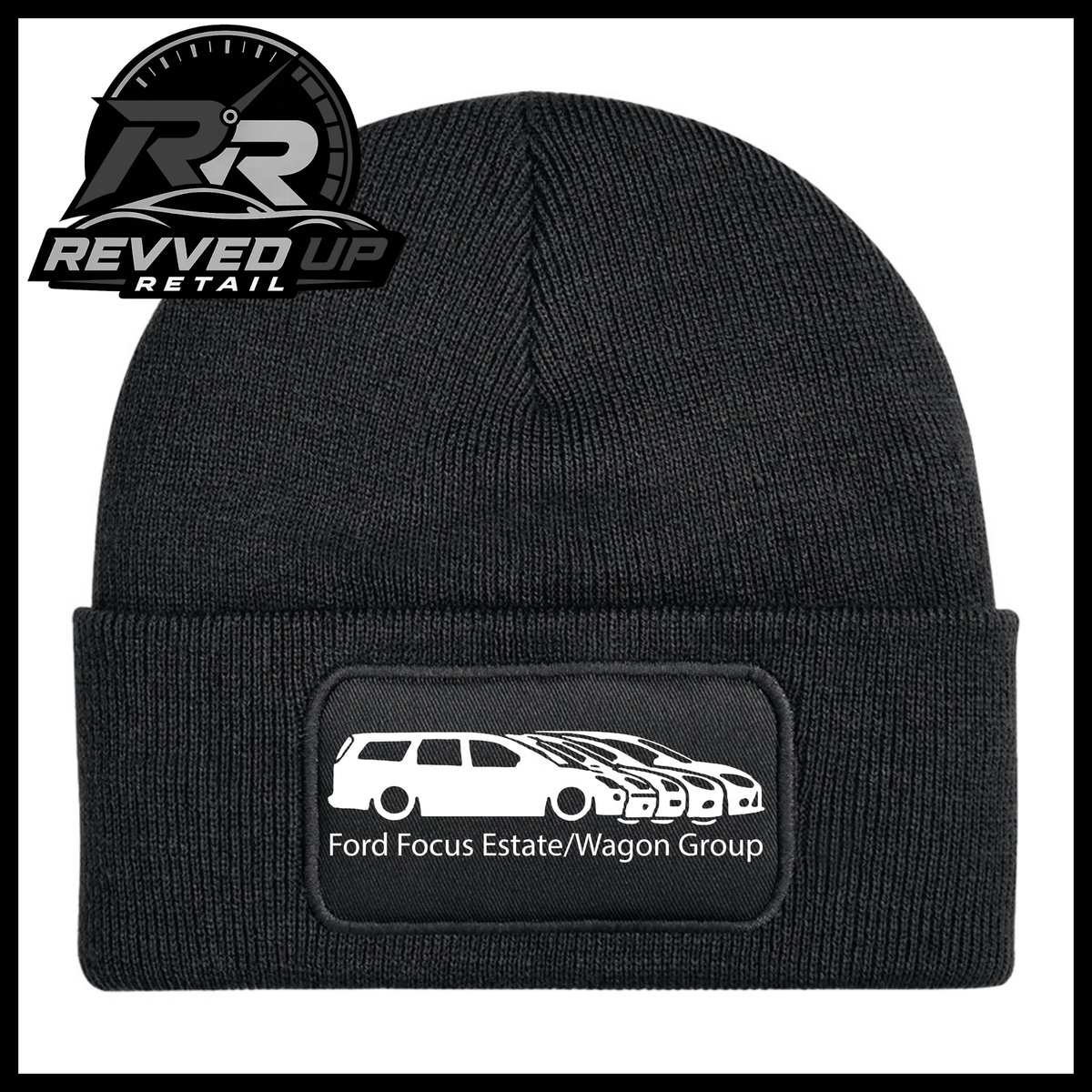 A black ribbed knit beanie with a folded cuff, featuring a black rectangular patch with a white car graphic and the text 'Ford Focus Estate/Wagon Group.' A Revved Up Retail logo appears in the top-left corner.