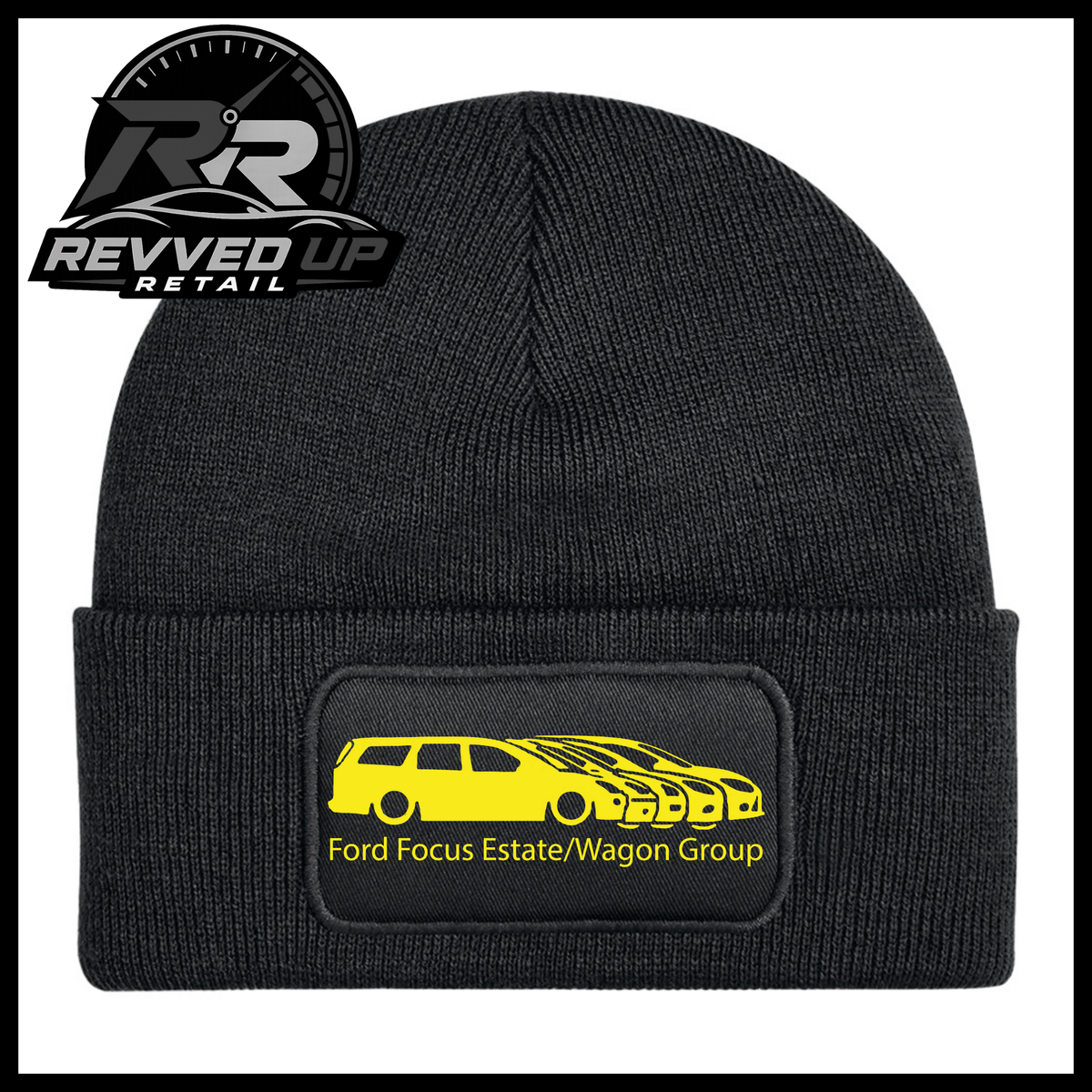A black ribbed knit beanie with a folded cuff, featuring a black rectangular patch with a yellow car graphic and the text 'Ford Focus Estate/Wagon Group.' A Revved Up Retail logo appears in the top-left corner.