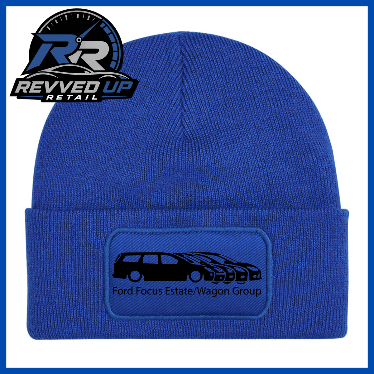 A royal blue knit beanie with a folded cuff featuring a rectangular patch that reads 'Ford Focus Estate/Wagon Group' with a black car graphic. The Revved Up Retail logo is displayed in the top-left corner.