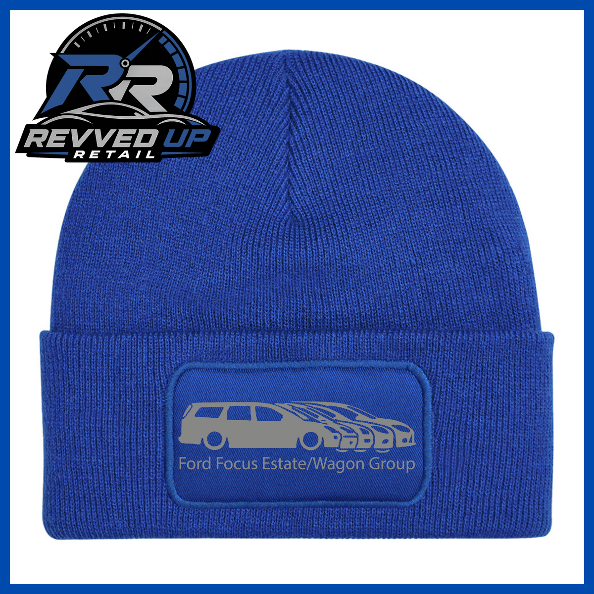 A royal blue knit beanie with a folded cuff featuring a rectangular patch that reads 'Ford Focus Estate/Wagon Group' with a grey car graphic. The Revved Up Retail logo is displayed in the top-left corner.