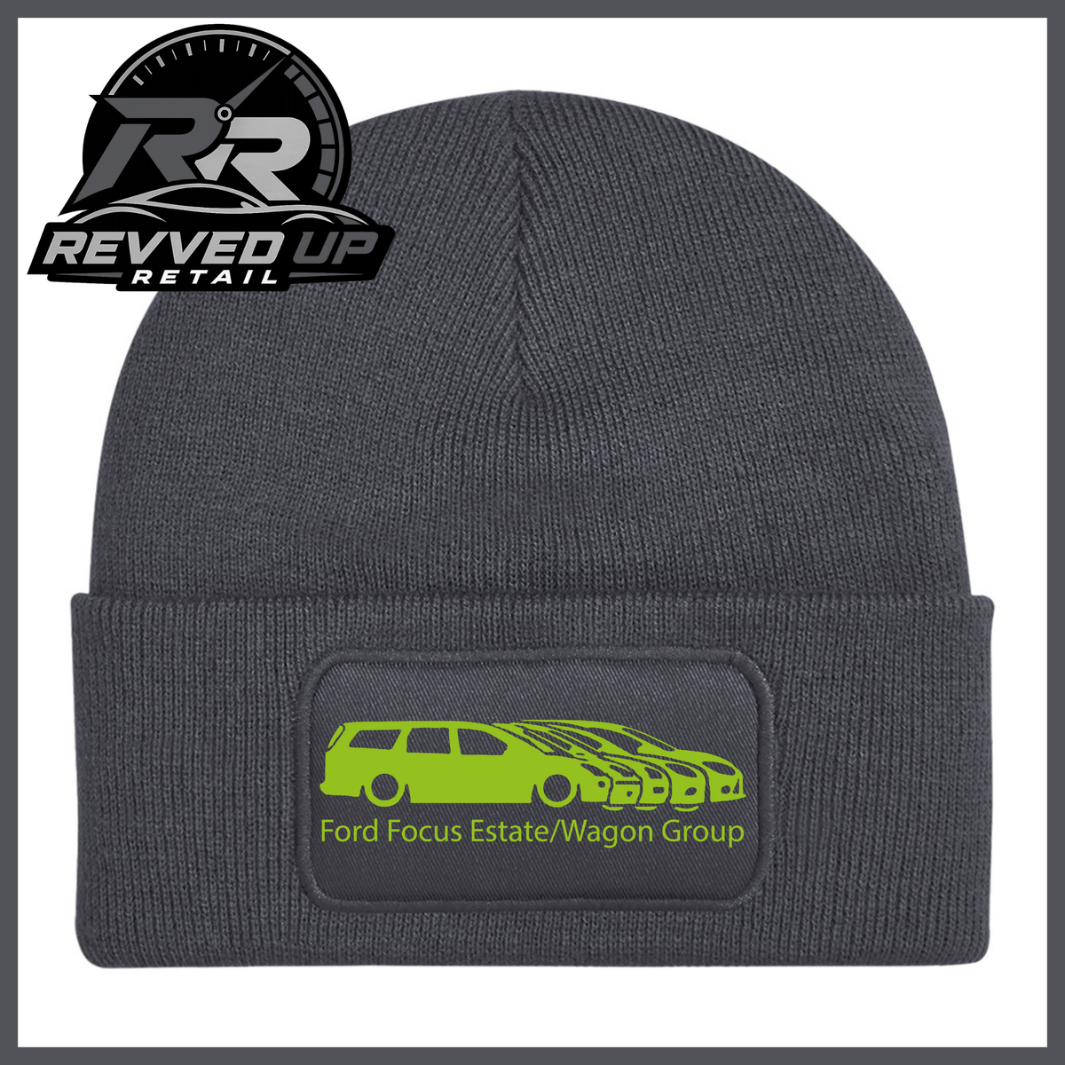 A grey ribbed knit beanie with a folded cuff, featuring a black rectangular patch with a green car graphic and the text 'Ford Focus Estate/Wagon Group.' A Revved Up Retail logo appears in the top-left corner.