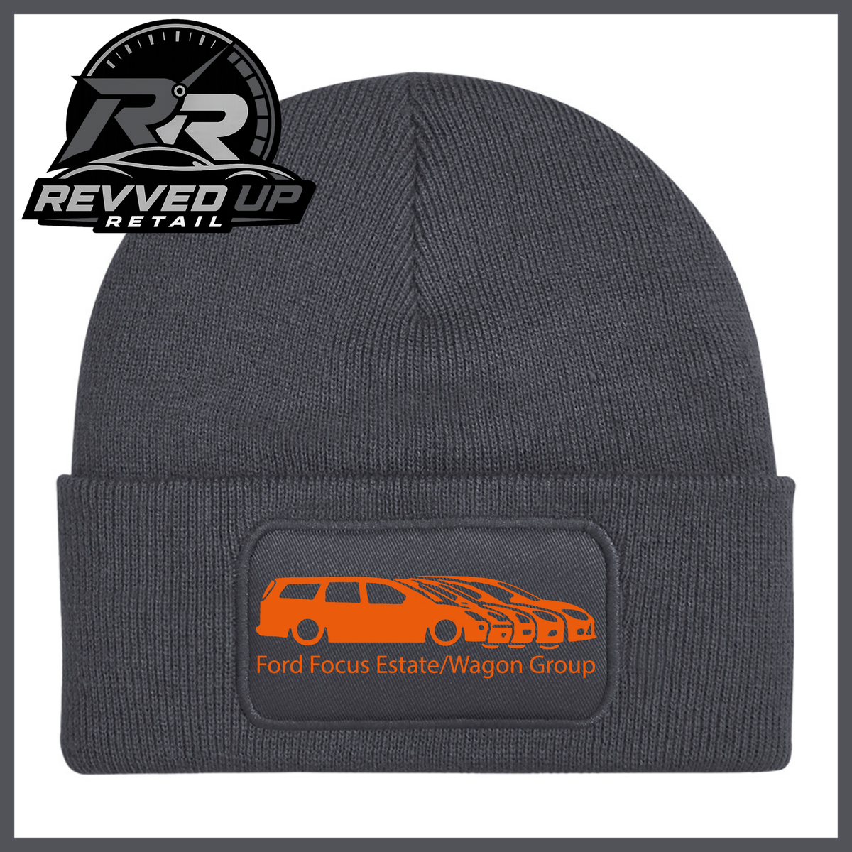 A grey ribbed knit beanie with a folded cuff, featuring a black rectangular patch with a orange car graphic and the text 'Ford Focus Estate/Wagon Group.' A Revved Up Retail logo appears in the top-left corner.