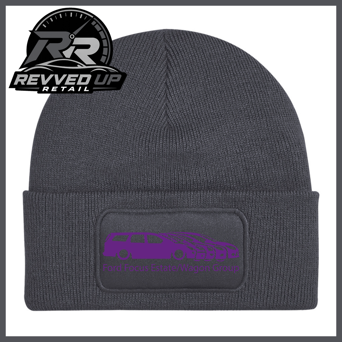 A grey ribbed knit beanie with a folded cuff, featuring a black rectangular patch with a purple car graphic and the text 'Ford Focus Estate/Wagon Group.' A Revved Up Retail logo appears in the top-left corner.