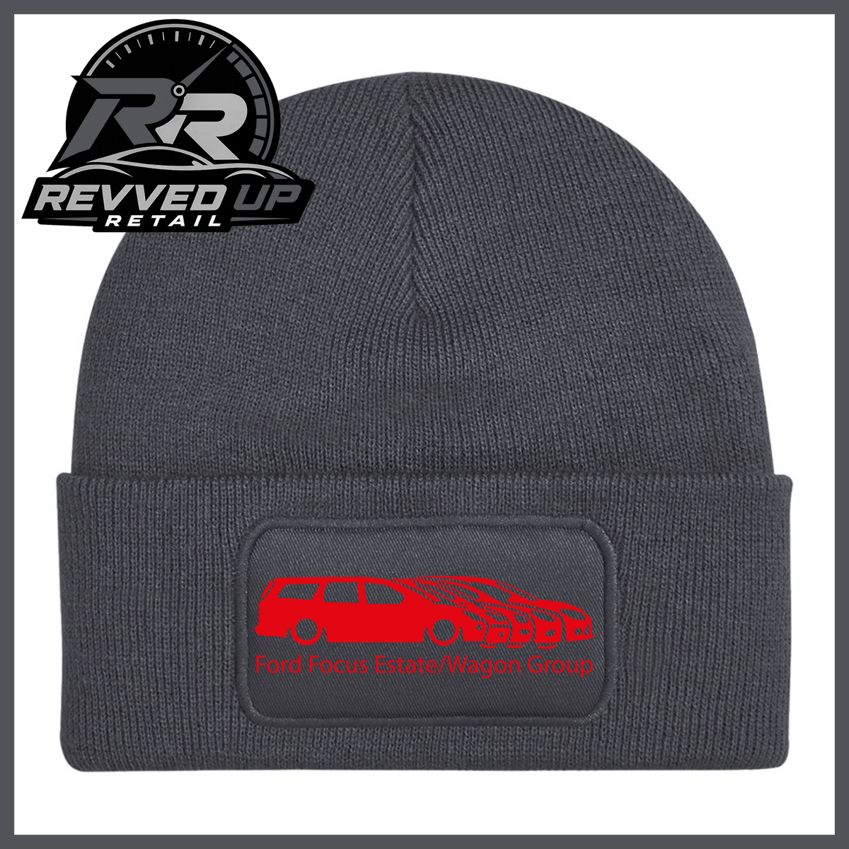 A grey ribbed knit beanie with a folded cuff, featuring a black rectangular patch with a red car graphic and the text 'Ford Focus Estate/Wagon Group.' A Revved Up Retail logo appears in the top-left corner.