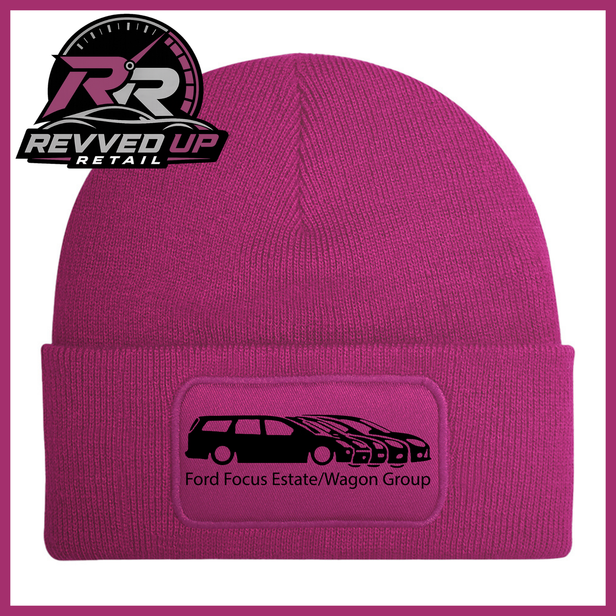 A fuchsia knit beanie with a folded cuff featuring a rectangular patch that reads 'Ford Focus Estate/Wagon Group' with a black car graphic. The Revved Up Retail logo is displayed in the top-left corner.