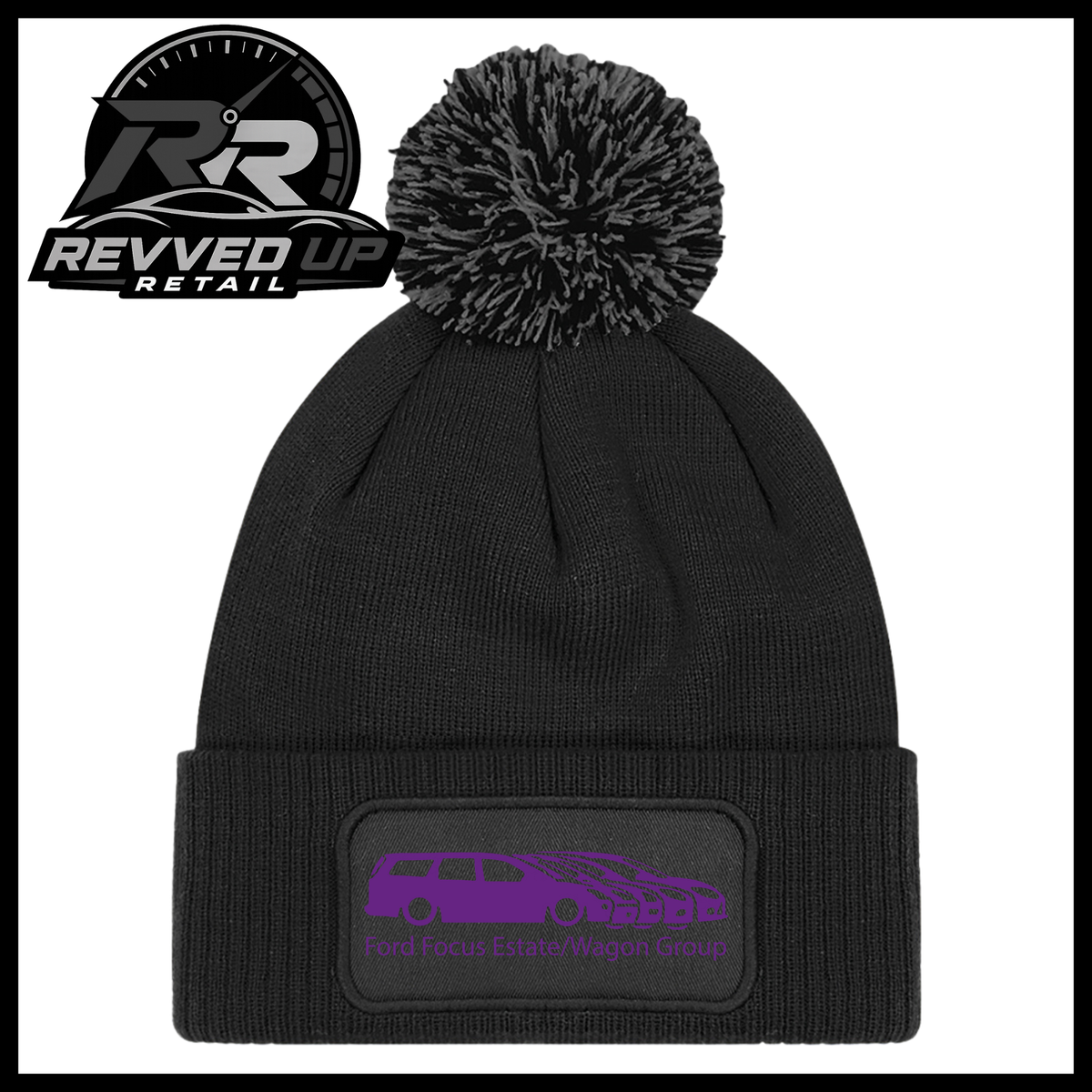 A black knit pom-pom beanie with a folded cuff featuring a black patch with a purple car graphic and the text 'Ford Focus Estate/Wagon Group'. A Revved Up Retail logo is visible in the top-left corner.