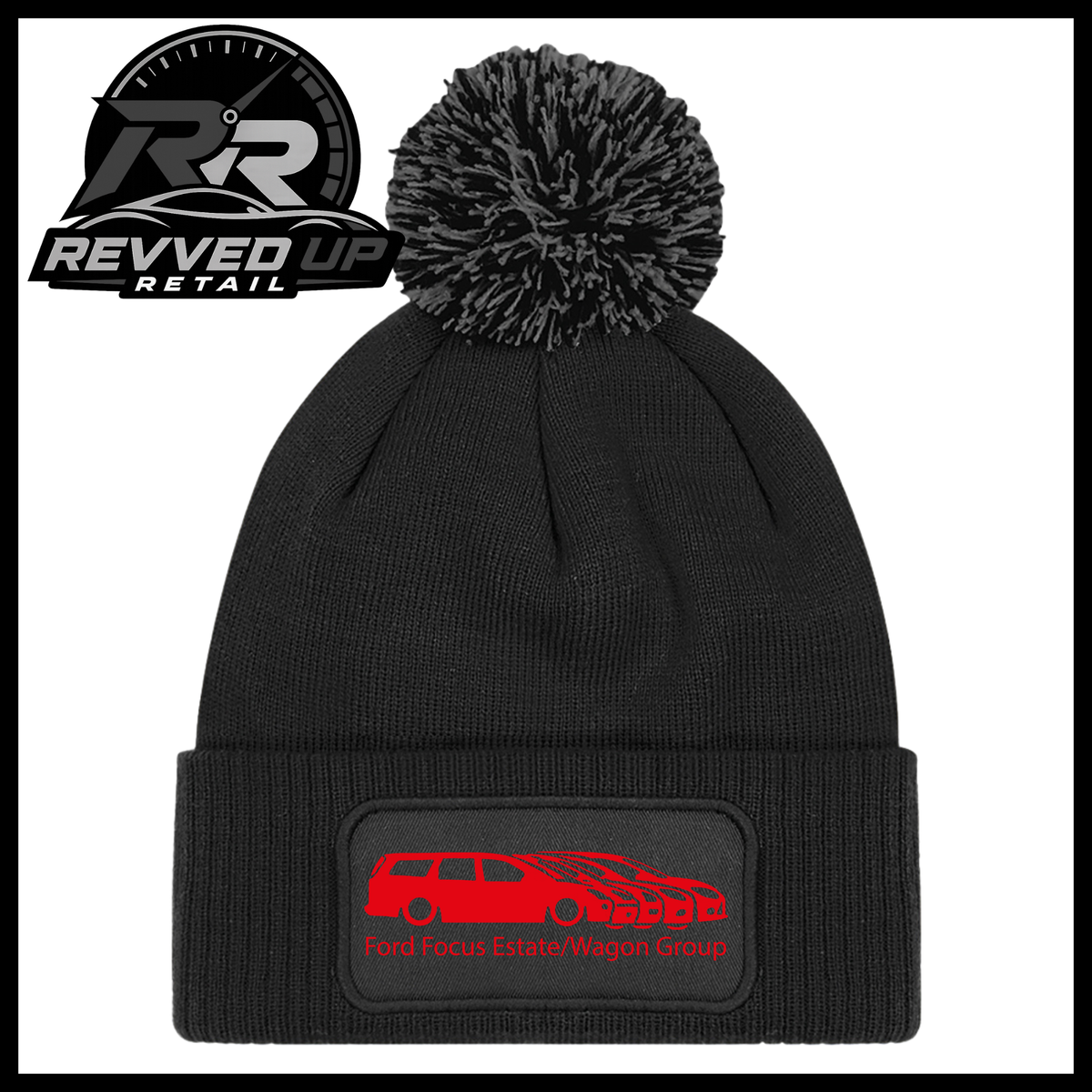 A black knit pom-pom beanie with a folded cuff featuring a black patch with a red car graphic and the text 'Ford Focus Estate/Wagon Group'. A Revved Up Retail logo is visible in the top-left corner.