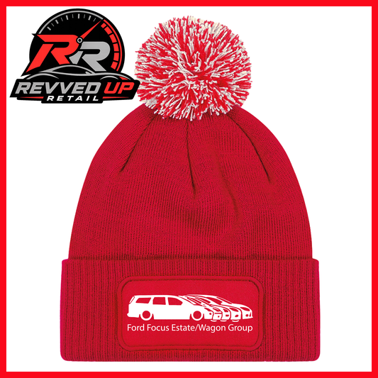 A red knit pom-pom beanie with a white patch on the cuff that reads 'Ford Focus Estate/Wagon Group' with a white car graphic. The Revved Up Retail logo is displayed in the top-left corner on a white background with a red border.