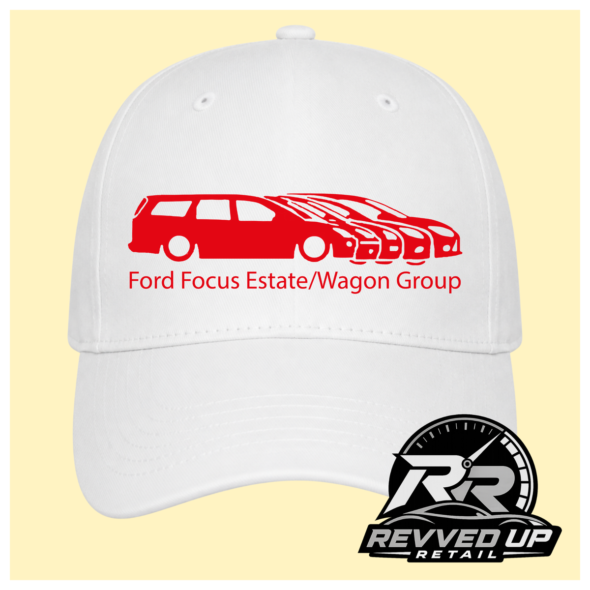 A white baseball cap with a red graphic of a Ford Focus estate and wagon group, along with the text 'Ford Focus Estate/Wagon Group' on the front. A Revved Up Retail logo is visible in the bottom right corner.