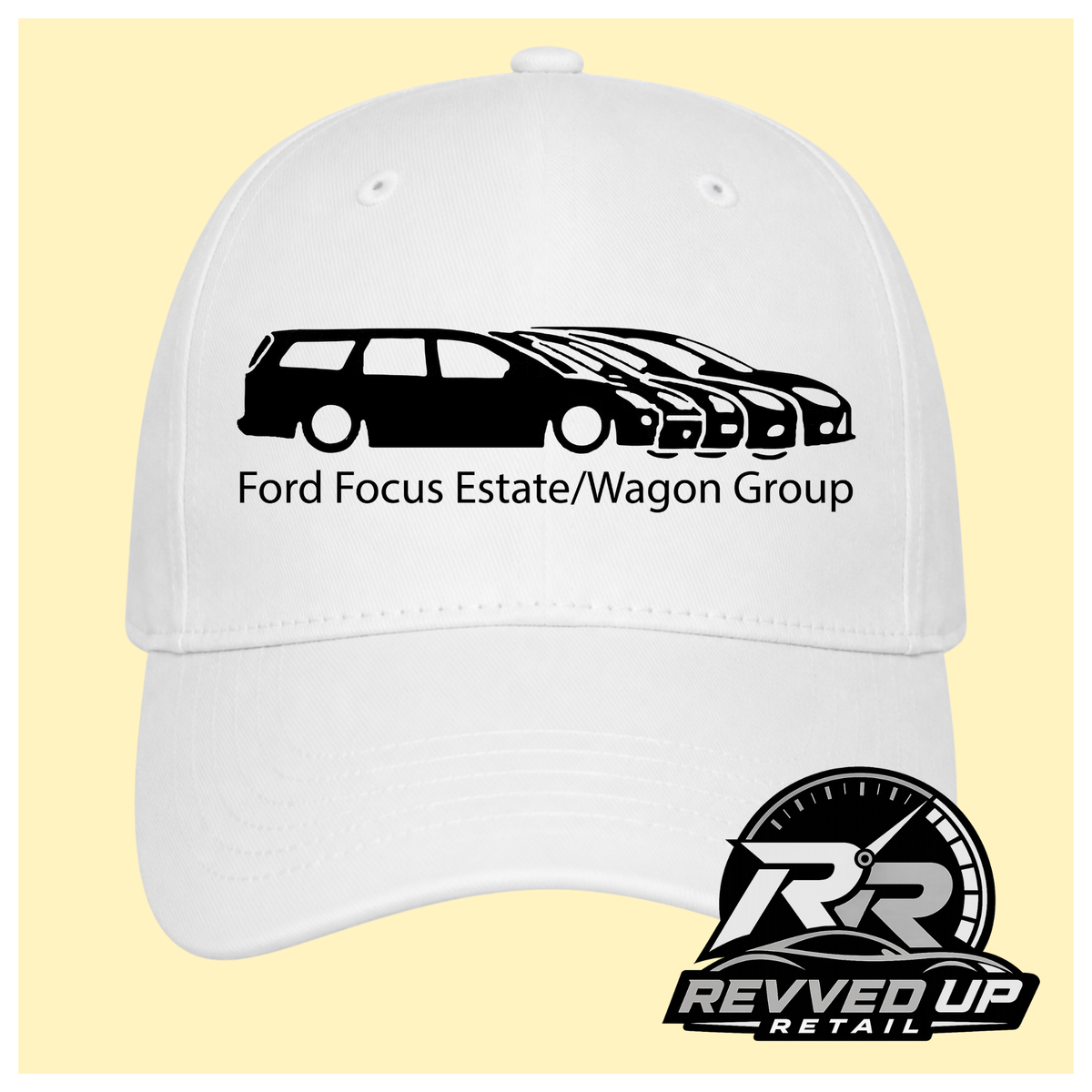 A white baseball cap with a black graphic of a Ford Focus estate and wagon group, labeled 'Ford Focus Estate/Wagon Group,' shown on a pale yellow background. A Revved Up Retail logo appears in the bottom right corner.