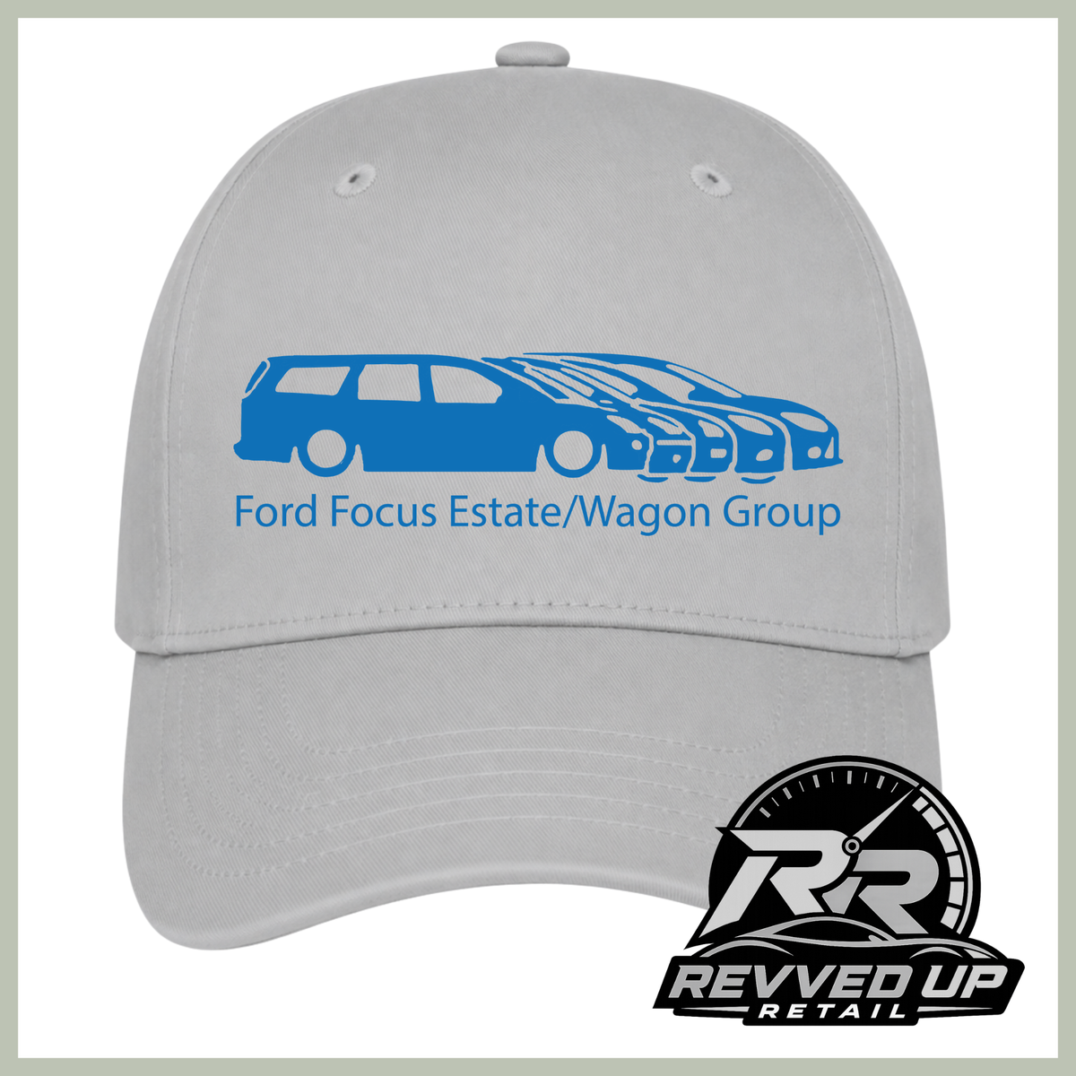 A light gray baseball cap with a blue graphic of multiple Ford Focus vehicles and the text 'Ford Focus Estate/Wagon Group' on the front. A 'Revved Up Retail' logo is overlaid in the bottom right corner.