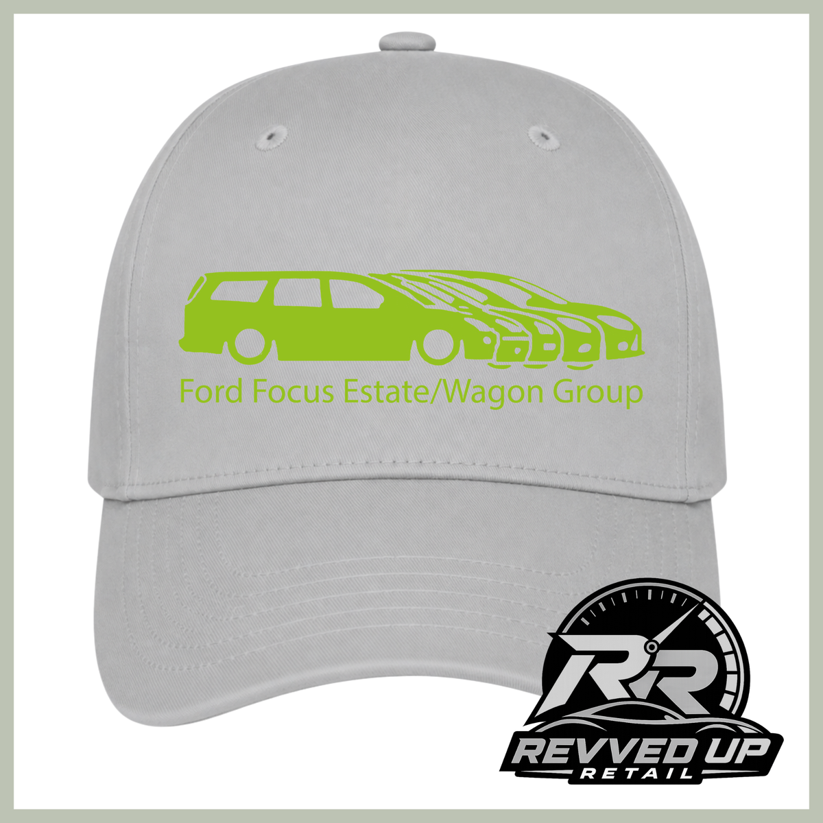 A grey baseball cap featuring a green graphic of a Ford Focus estate and wagon group with the text 'Ford Focus Estate/Wagon Group' on the front. A Revved Up Retail logo is visible in the bottom right corner.