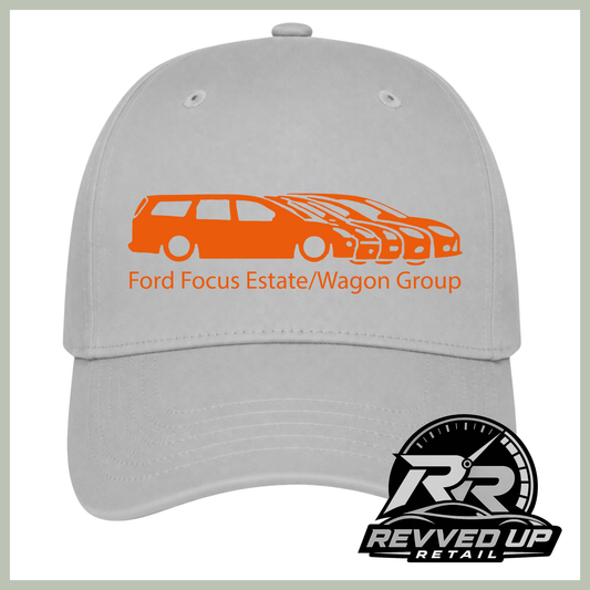 A light gray baseball cap featuring an orange graphic of a Ford Focus estate and wagon group with the text 'Ford Focus Estate/Wagon Group' on the front. A 'Revved Up Retail' logo is displayed in the bottom right corner.