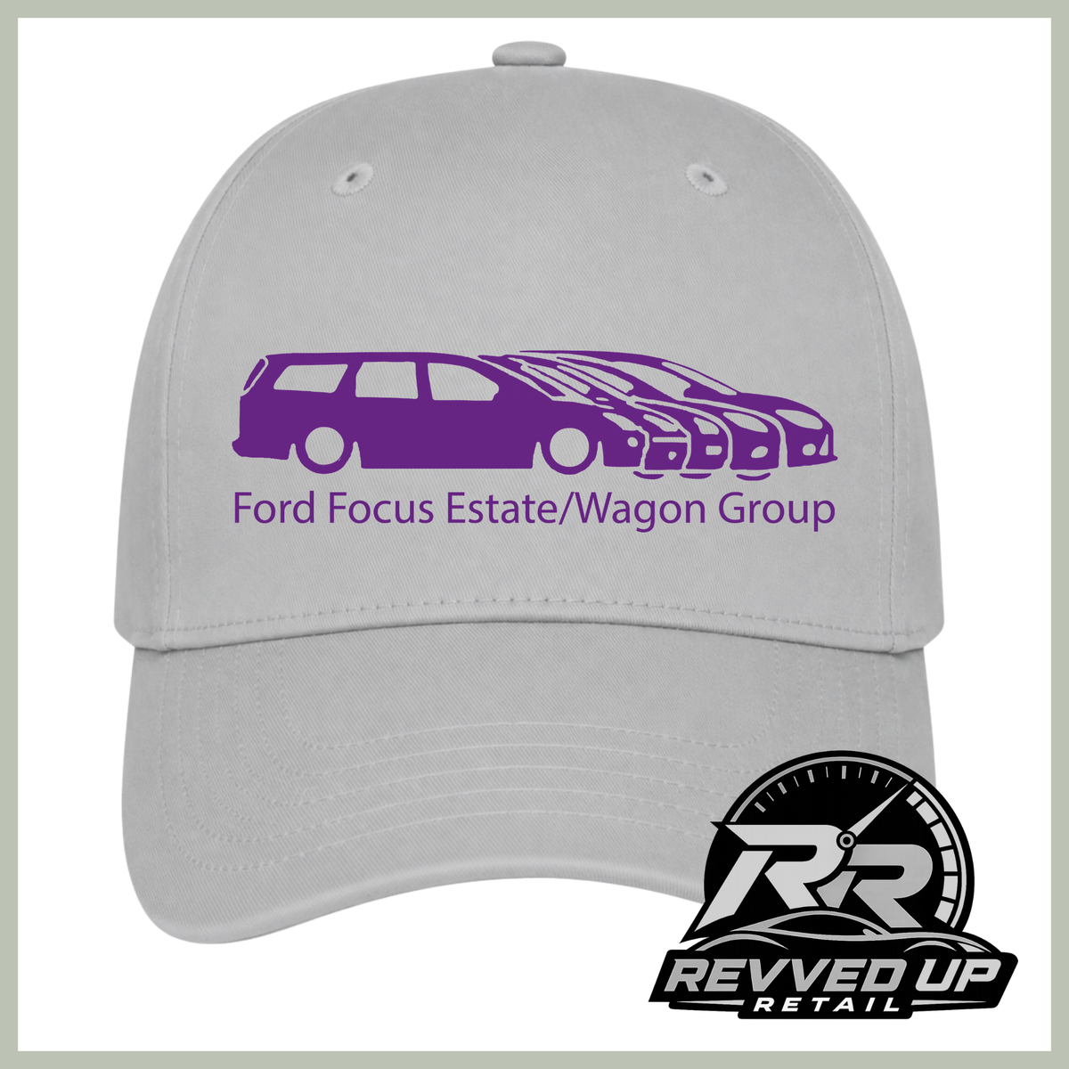 A light gray baseball cap with a purple graphic of stylized Ford Focus cars and the text 'Ford Focus Estate/Wagon Group' on the front. A Revved Up Retail logo is visible in the bottom right corner.
