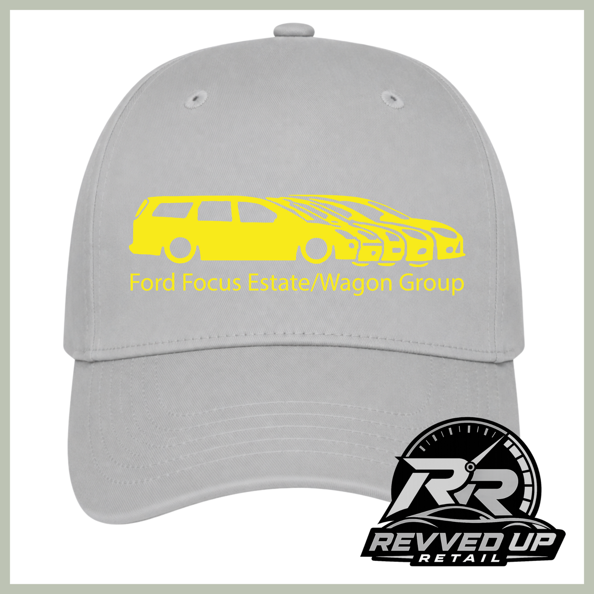 A light gray baseball cap with a yellow graphic of a Ford Focus Estate and Wagoneer group car, featuring the text 'Ford Focus Estate/Wagon Group'. A 'Revved Up Retail' logo is visible in the bottom right corner.