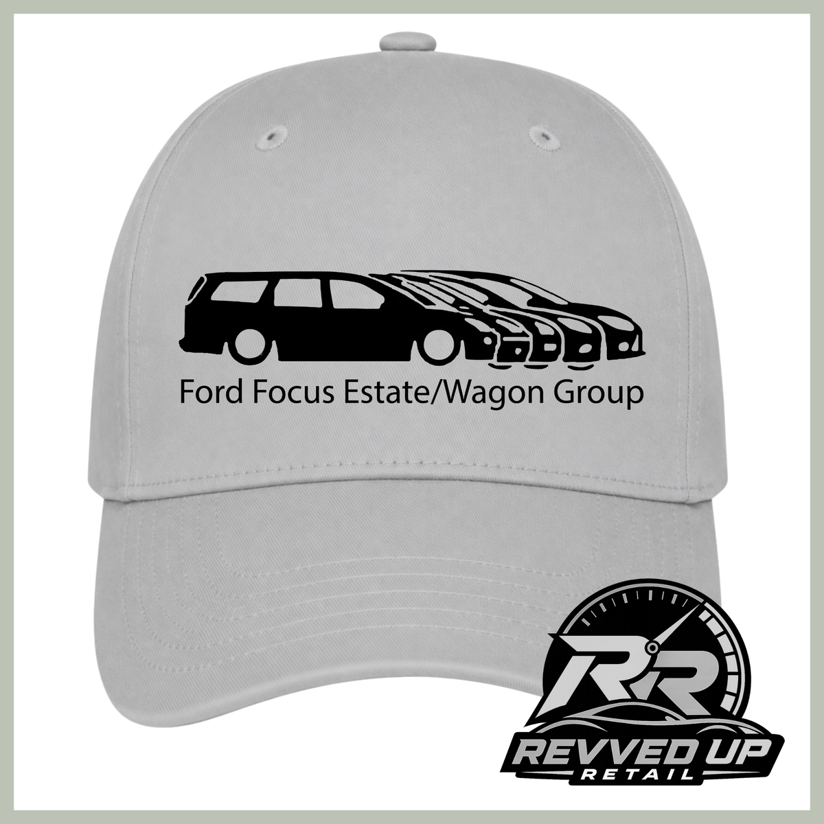 A light gray baseball cap featuring a black graphic of Ford Focus Estate and wagon group cars with the text 'Ford Focus Estate/Wagon Group' printed on the front. A Revved Up Retail logo is visible in the bottom right corner.