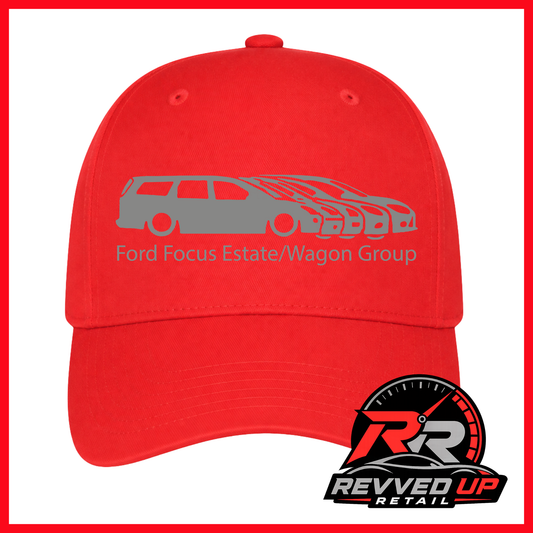 A bright red baseball cap with a gray graphic of a Ford Focus estate and wagon, along with the text 'Ford Focus Estate/Wagon Group'. A Revved Up Retail logo is visible in the bottom right corner.