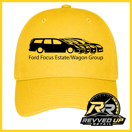 A bright yellow baseball cap with a black graphic of a Ford Focus estate and wagon, along with the text 'Ford Focus Estate/Wagon Group'. A Revved Up Retail logo is displayed in the bottom right corner.